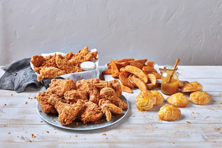 Family meal with chicken, tenders, biscuits and fries